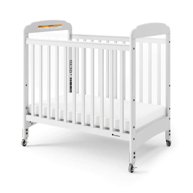 Foundations Serenity Compact Clearview Daycare Crib, Fixed Side, Durable Wood Construction, Non-Marking Casters (2 Locking), Clear End Panels, Includes 3” InfaPure Foam Mattress (White)