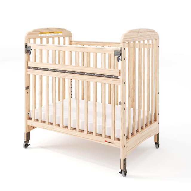 Foundations Serenity SafeReach Slatted Crib with Adjustable Mattress Board, Compact Wooden Baby Crib with Commercial Grade Casters, Includes 3” Foam Mattress (Natural)