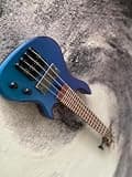 4 Strings Chameleon Metallic Blue Cailcedra Body Mini Electric Bass Guitar 436mm Scale Length, Purple Heartwood Fingerboard,55090 Stainless Frets,Mahogany & Maple Pcs Neck,Black Hardware With Gig Bag