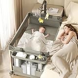 Trimigo 4-in-1 Pack and Play, Baby Bassinet Bedside Sleeper, Baby Playard, Bedside Crib with Changing Table, Folding Travel Crib with Musical Toy Rack&Bag, 4-Height Adjust, Newborn-Toddler(Olive Drab)